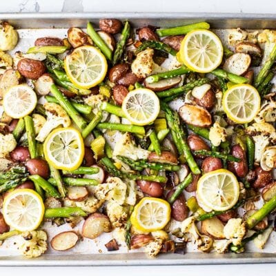 A sheet pan with colorful roasted spring vegetables.