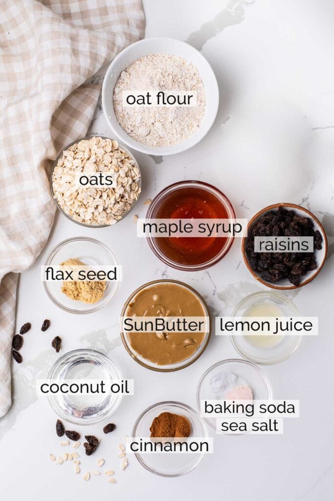 The ingredients needed to make healthy oatmeal raisin cookies.