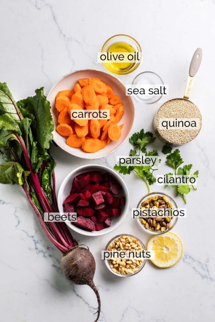 The ingredients needed for a roasted carrot and beet quinoa salad.
