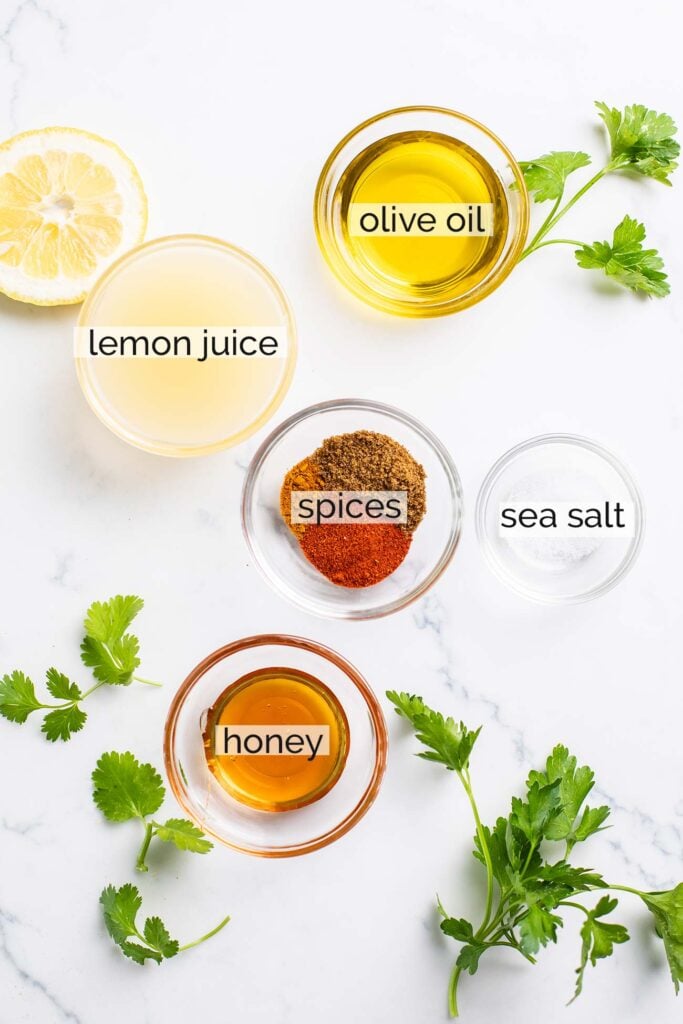 Ingredients in a lemon vinaigrette shown with labels.