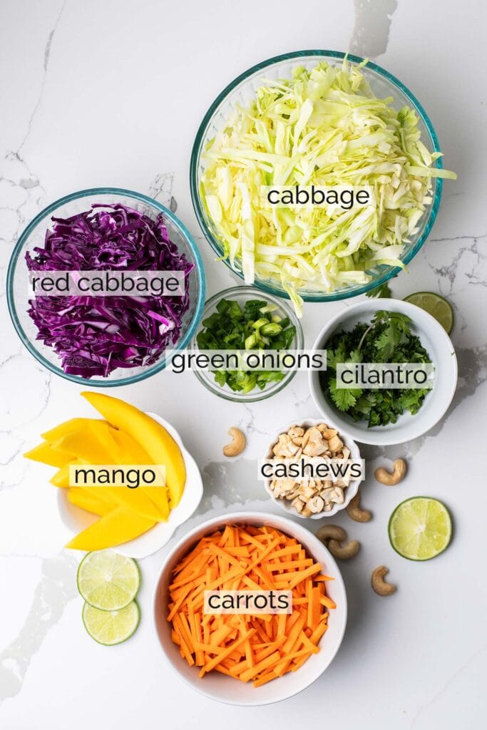 The ingredients needed for a crunchy cabbage and carrot salad.