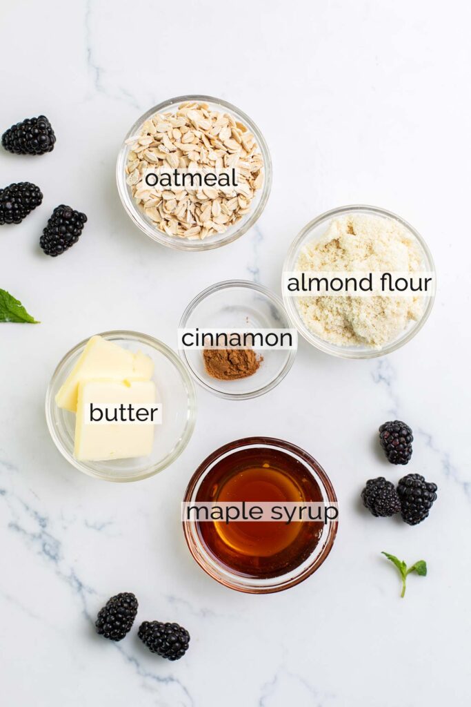 The ingredients needed to make the oat crumble topping shown with labels.