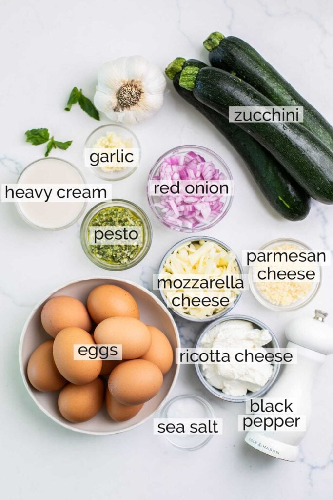 The ingredients needed for a crustless zucchini quiche.