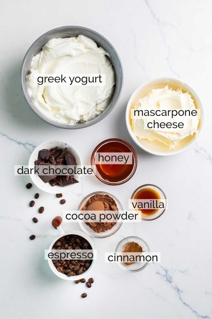 The ingredients needed to make a greek yogurt mascarpone filling for tiramisu.