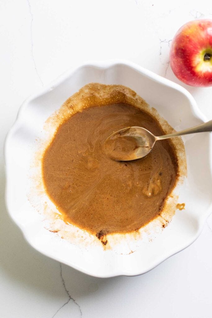 The sunbutter, maple syrup, and coconut oil mixed together in a bowl.