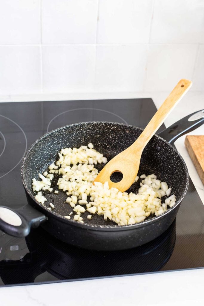 Step 1 shows sauteing the onion until soft. 