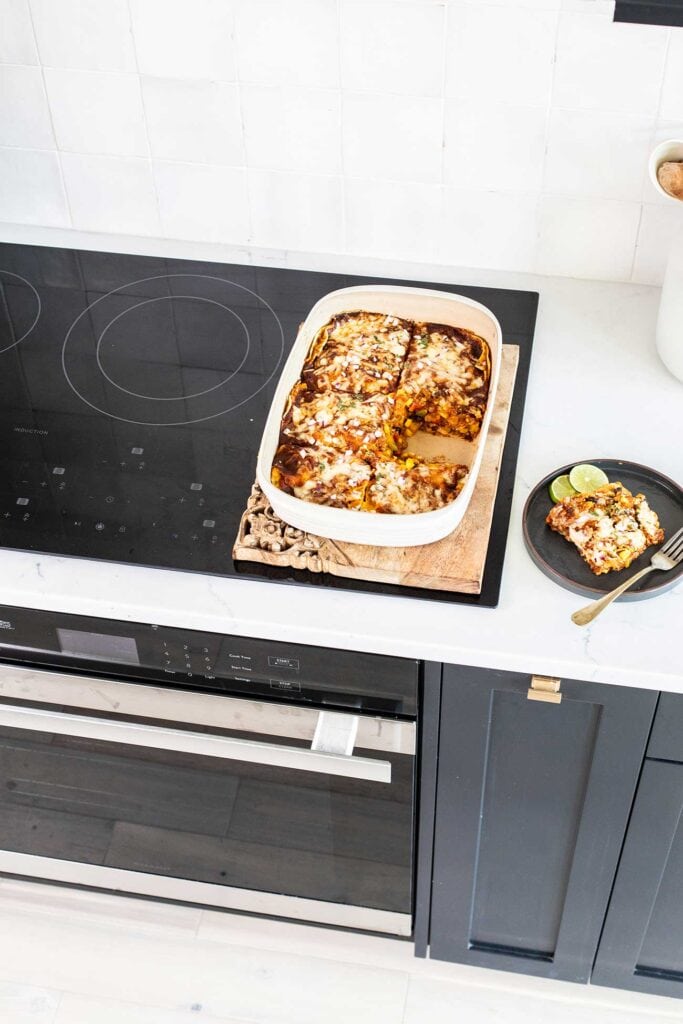 An enchilada casserole sitting on top of the Sharp European Convection Oven.