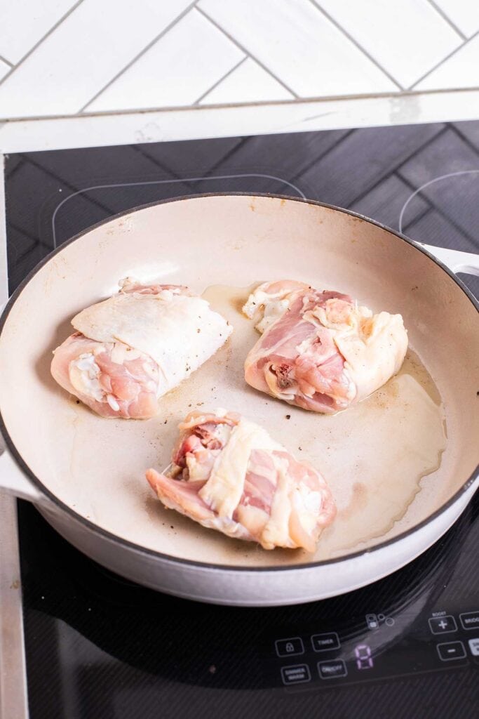 Step 2 shows browning the chicken thighs.