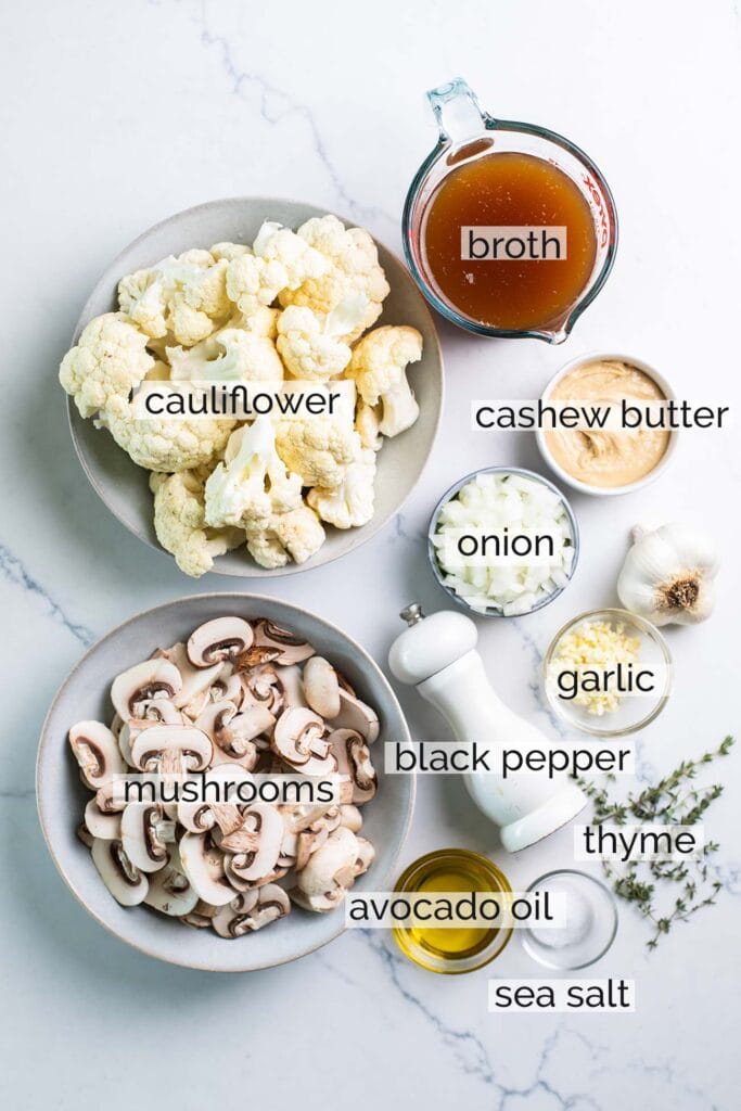 The ingredients needed to make a creamy dairy free mushroom soup shown labeled.