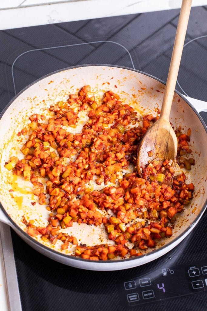 The soffrito shown caramelized along with garlic and tomato paste.