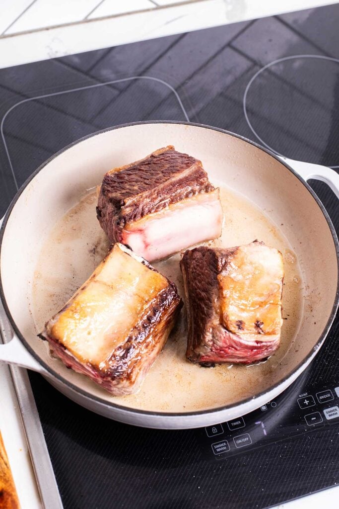 Step 1 is browning the short ribs until a deep brown color is formed.