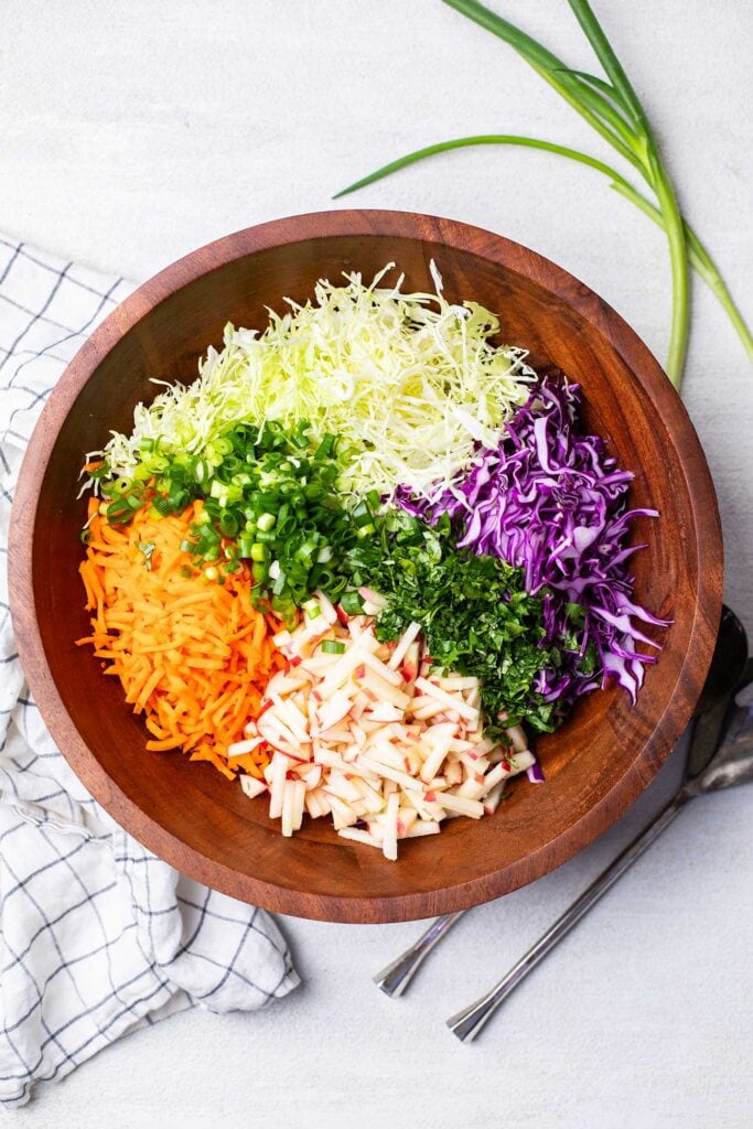 A colorful mixture of vegetables shown in a salad bowl.