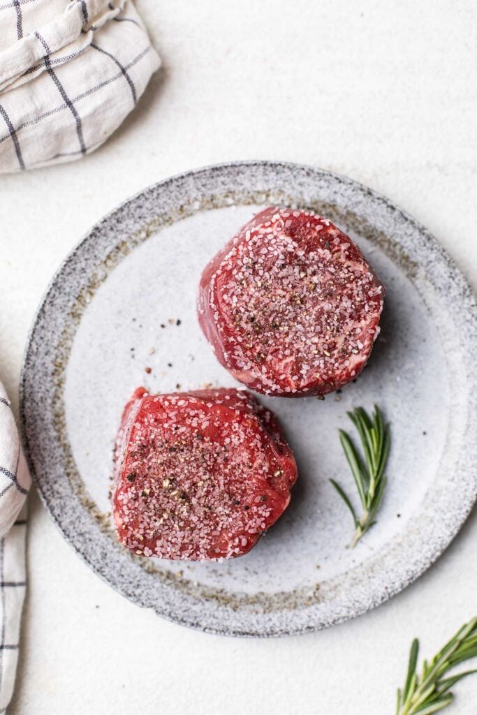 Step 1 is to heavily salt and pepper the steaks.