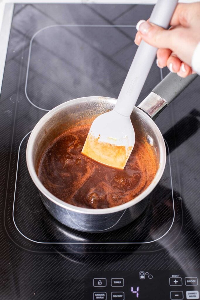 BBQ sauce in a small pan simmering.