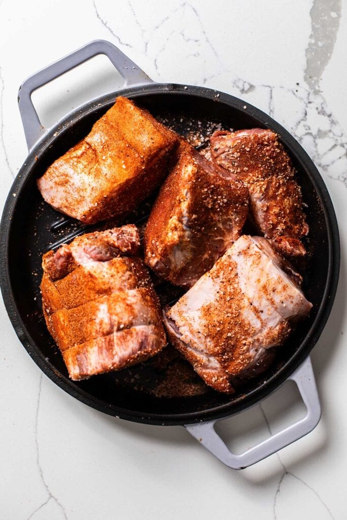 Chunks of pork rubbed with the spice blend.