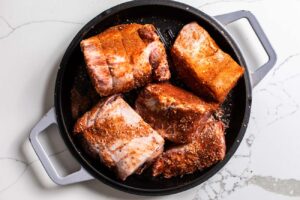 Chunks of pork rubbed in spices.