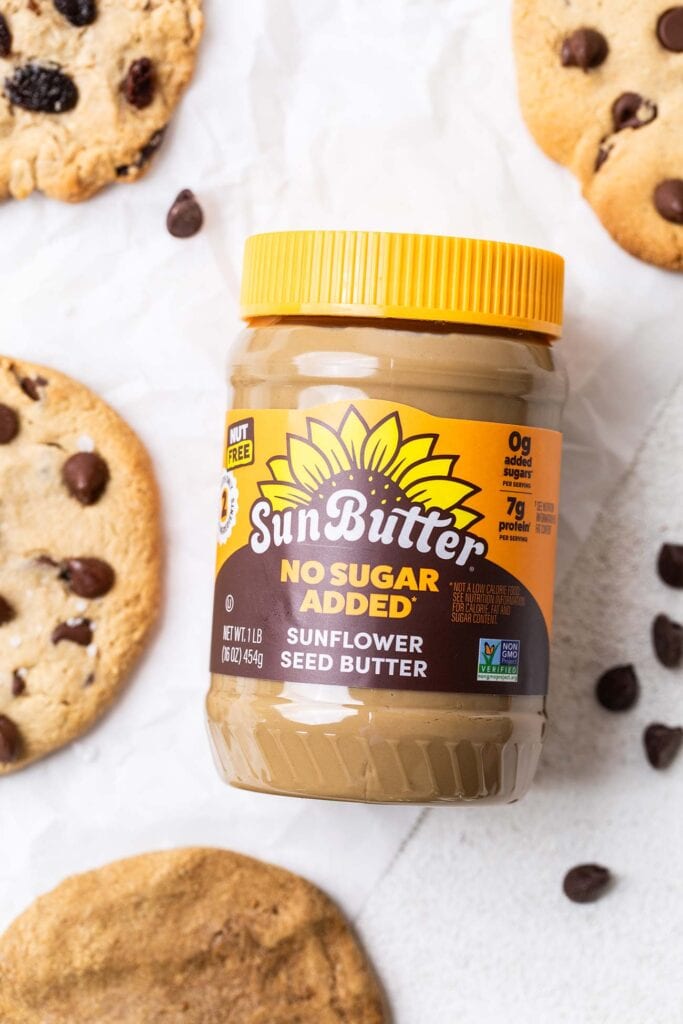 A jar of SunButter surrounded by protein cookies.