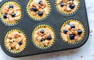 Fill muffin cups almost to the top. Top with a teaspoon streusel topping each, and extra blueberries.