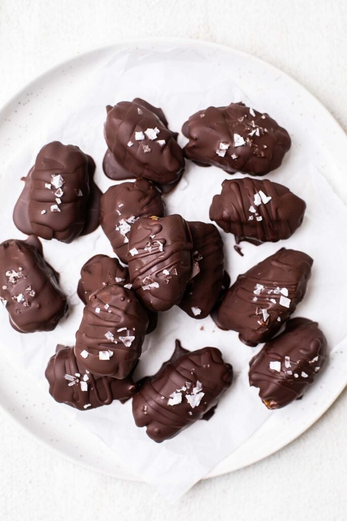 A plate of chocolate dates.