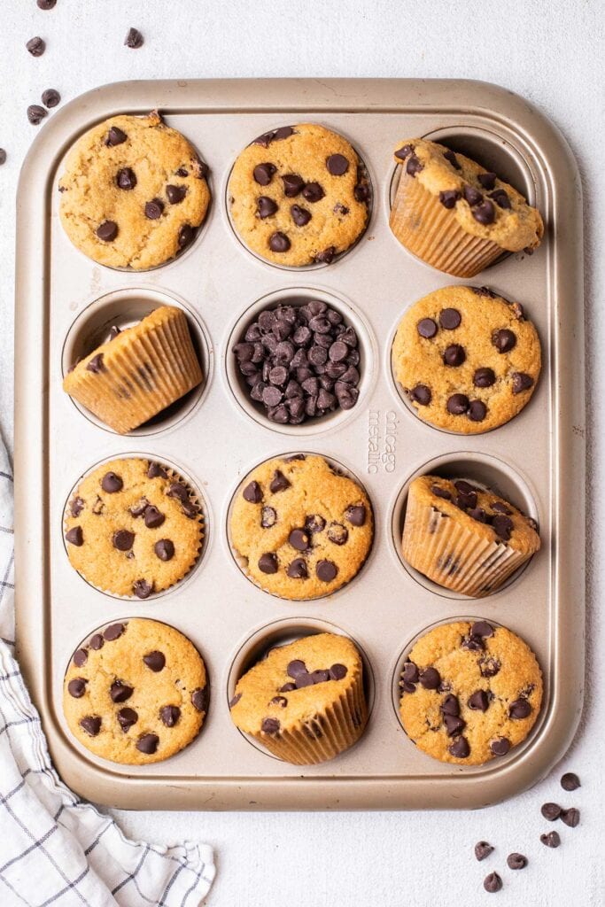 Muffins cooling in a baking pan.