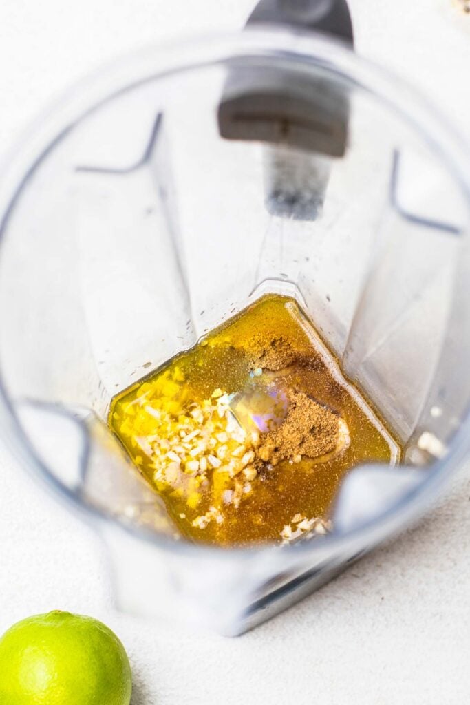 The dressing ingredients shown in a blender.