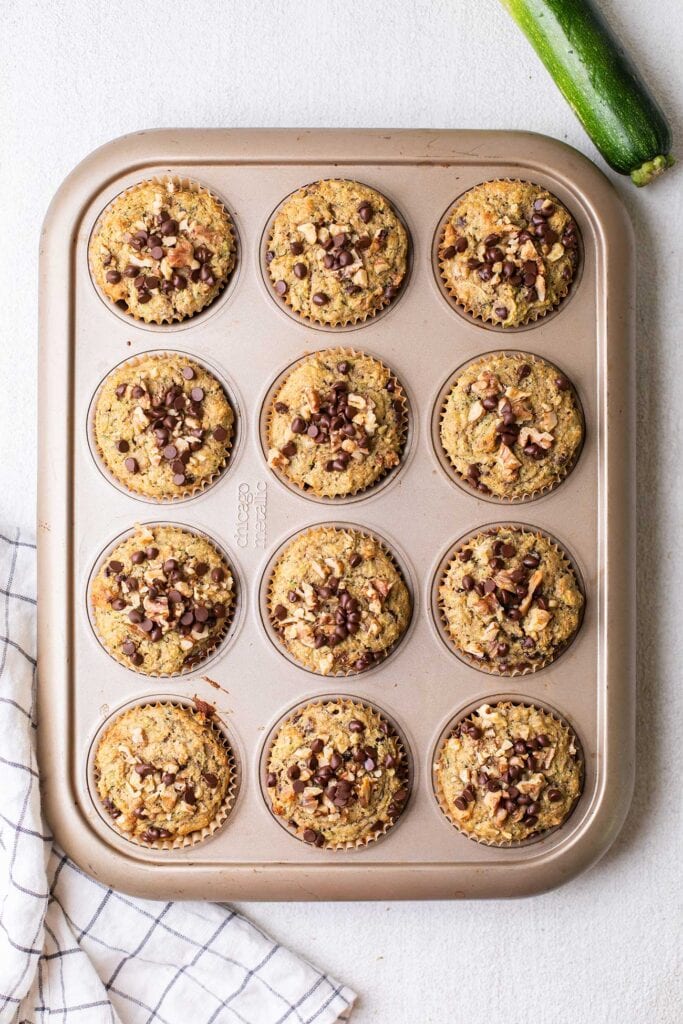 Muffin batter divided between 12 muffin papers.