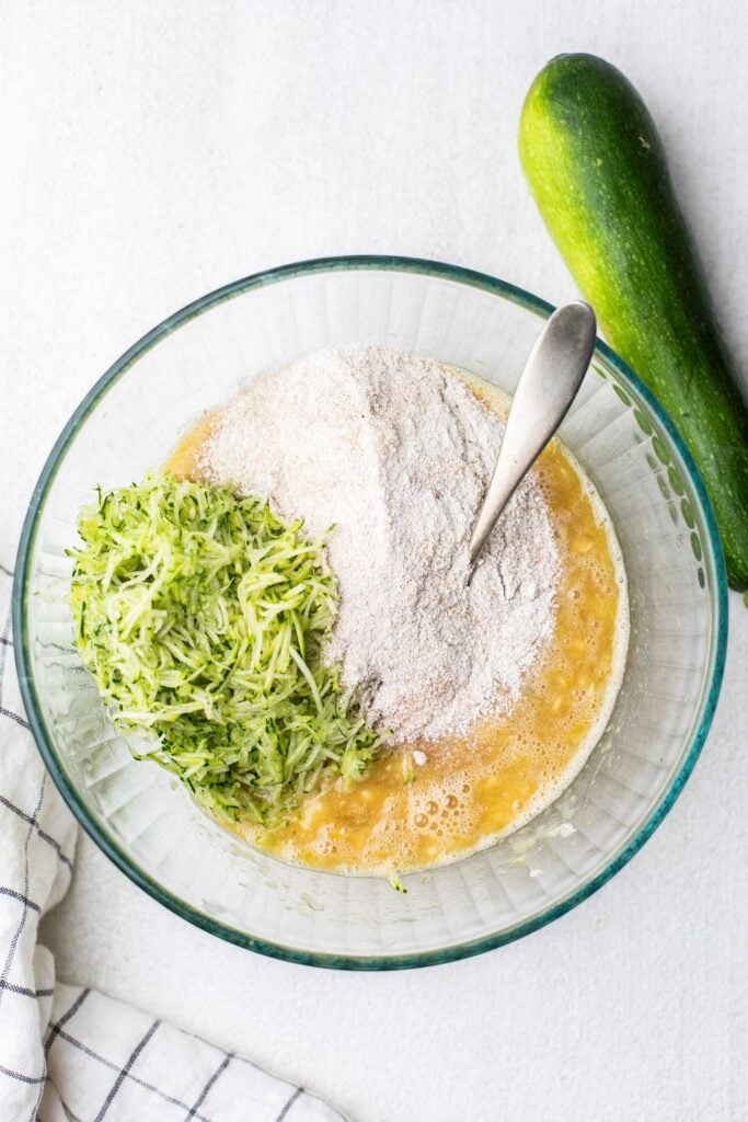 The dry ingredients and shredded zucchini added to the wet ingredients.
