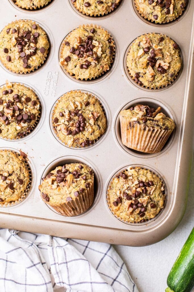 Showing how to tilt the muffins in the muffin tin to reduce steaming.