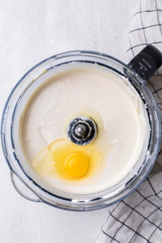 An egg added to the cream cheese mixture.
