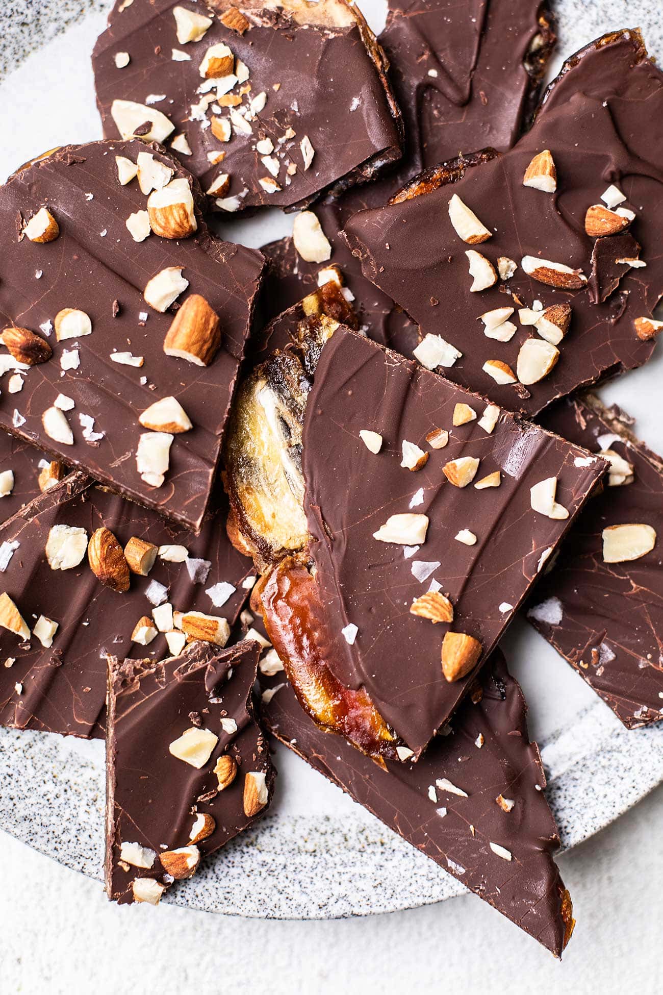 A plate of date bark broken into pieces.