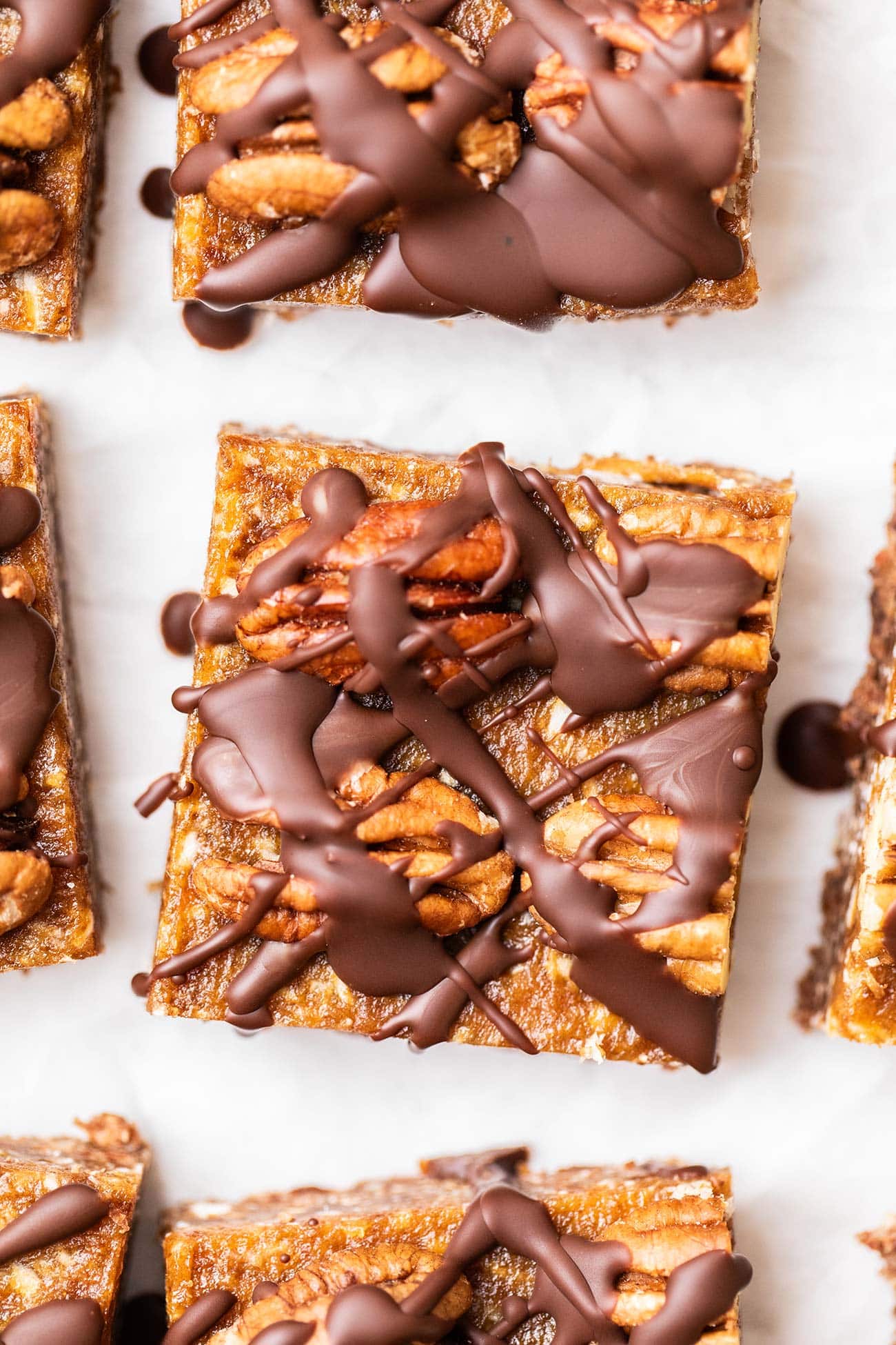 A close up shot showing the chocolate pecan topping on a german chocolate bar cookie.