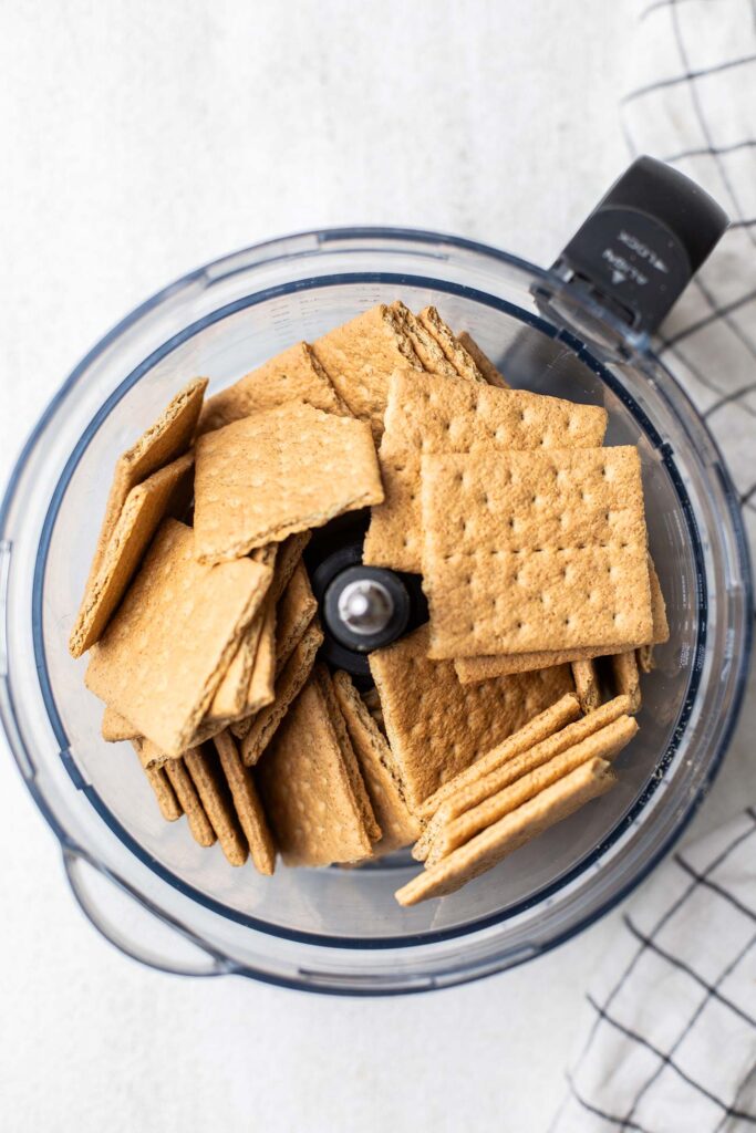 Graham crackers in a food processor bowl.