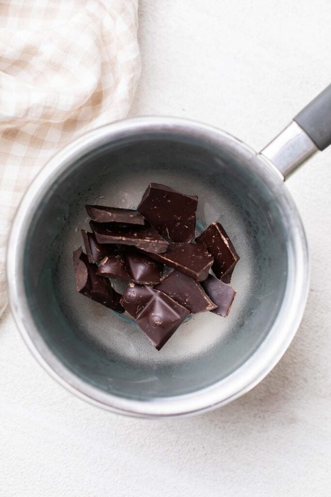 Step 2 shows melting a dark chocolate bar in a double boiler.