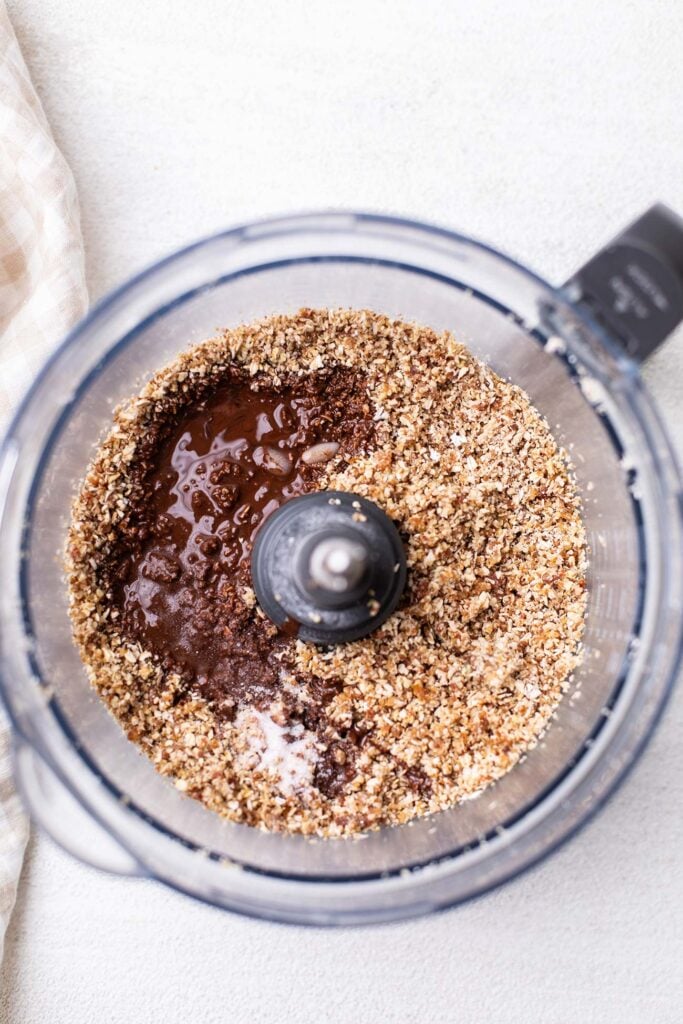 Melted dark chocolate added to the food processor.