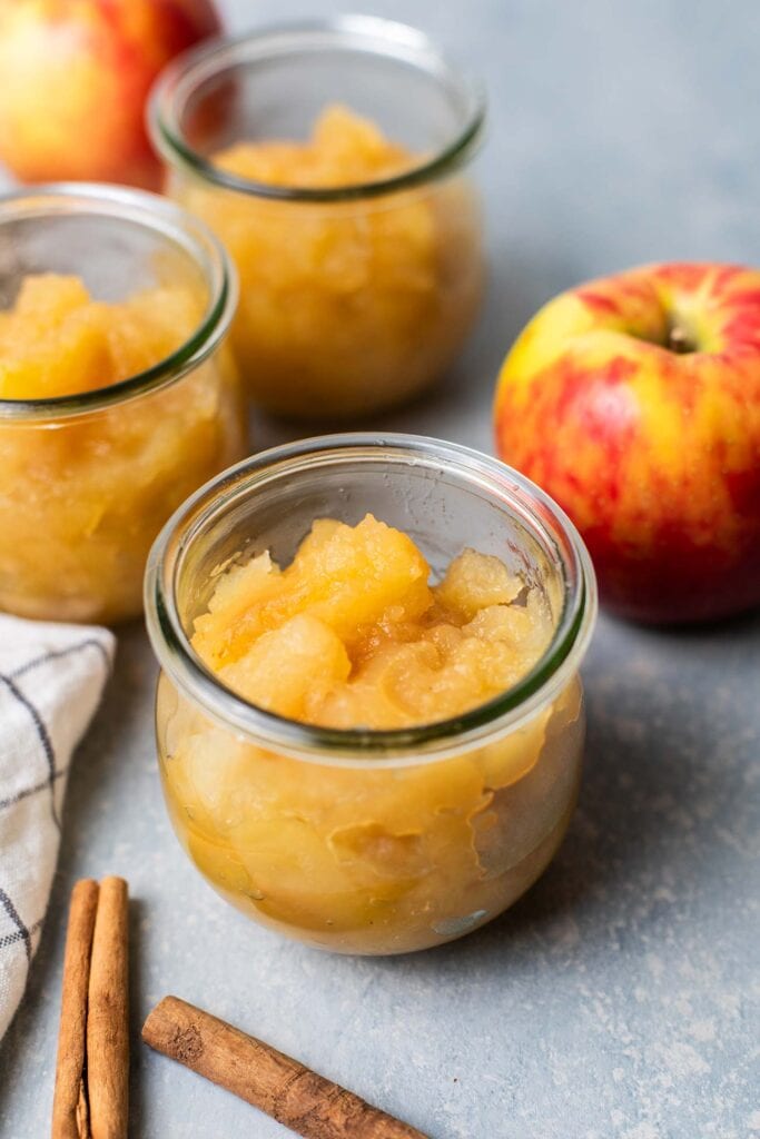 Applesauce shown in jars for storage.