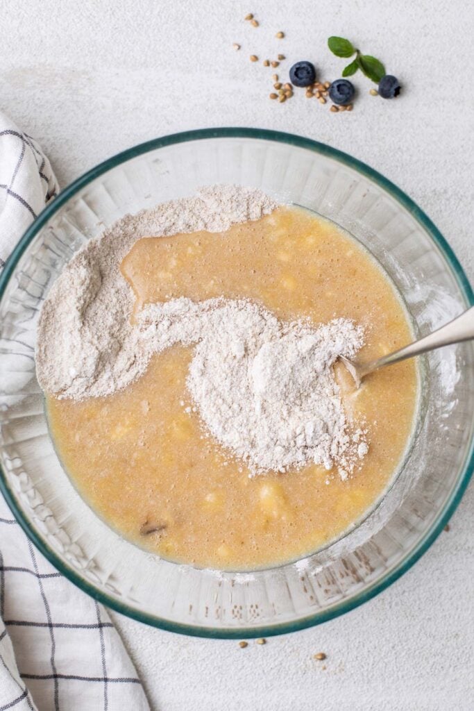 Add the dry ingredients into the bowl with the wet ingredients.