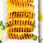 Grilled pineapple on a platter.