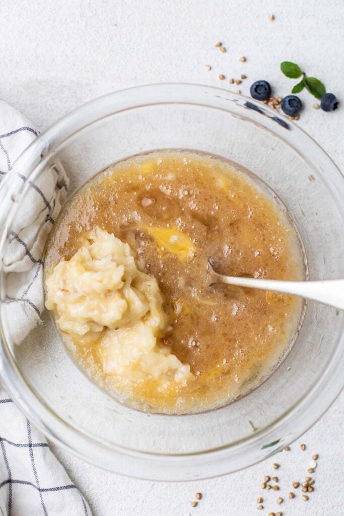 The wet ingredients whisked together with a mashed banana.