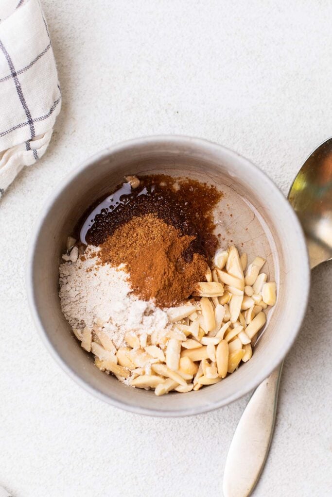 A small bowl with the ingredients for the streusel topping.