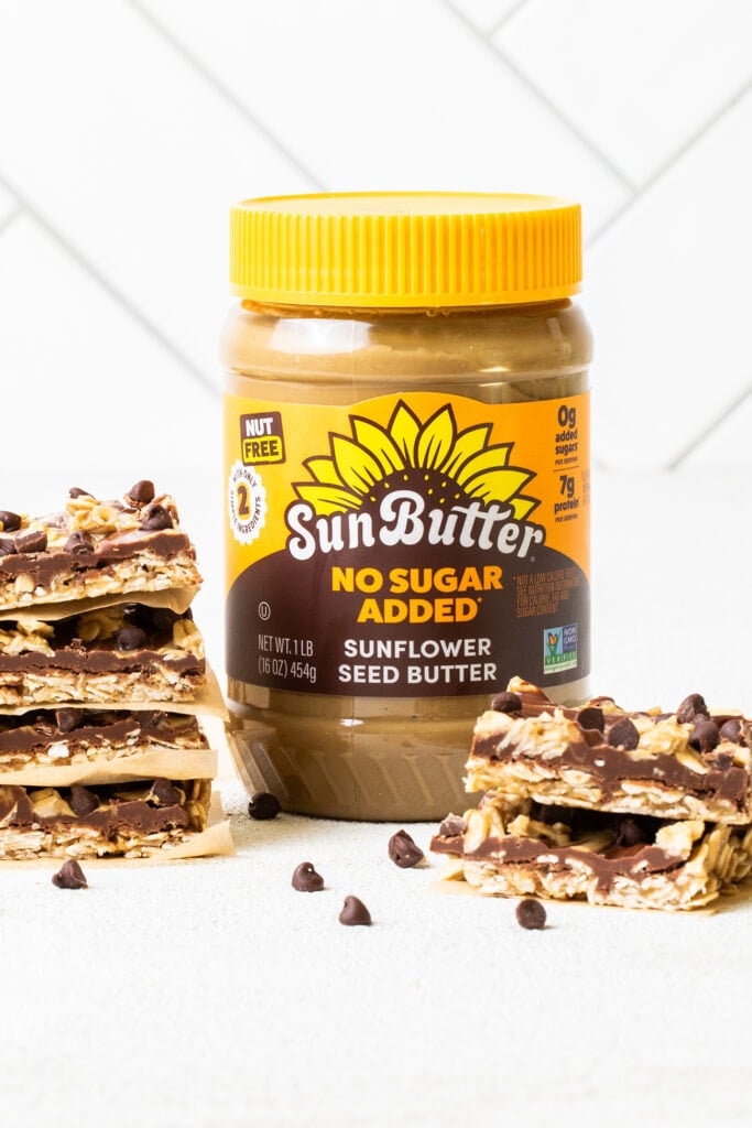 Chocolate Oat Bars sitting next to a jar of SunButter.