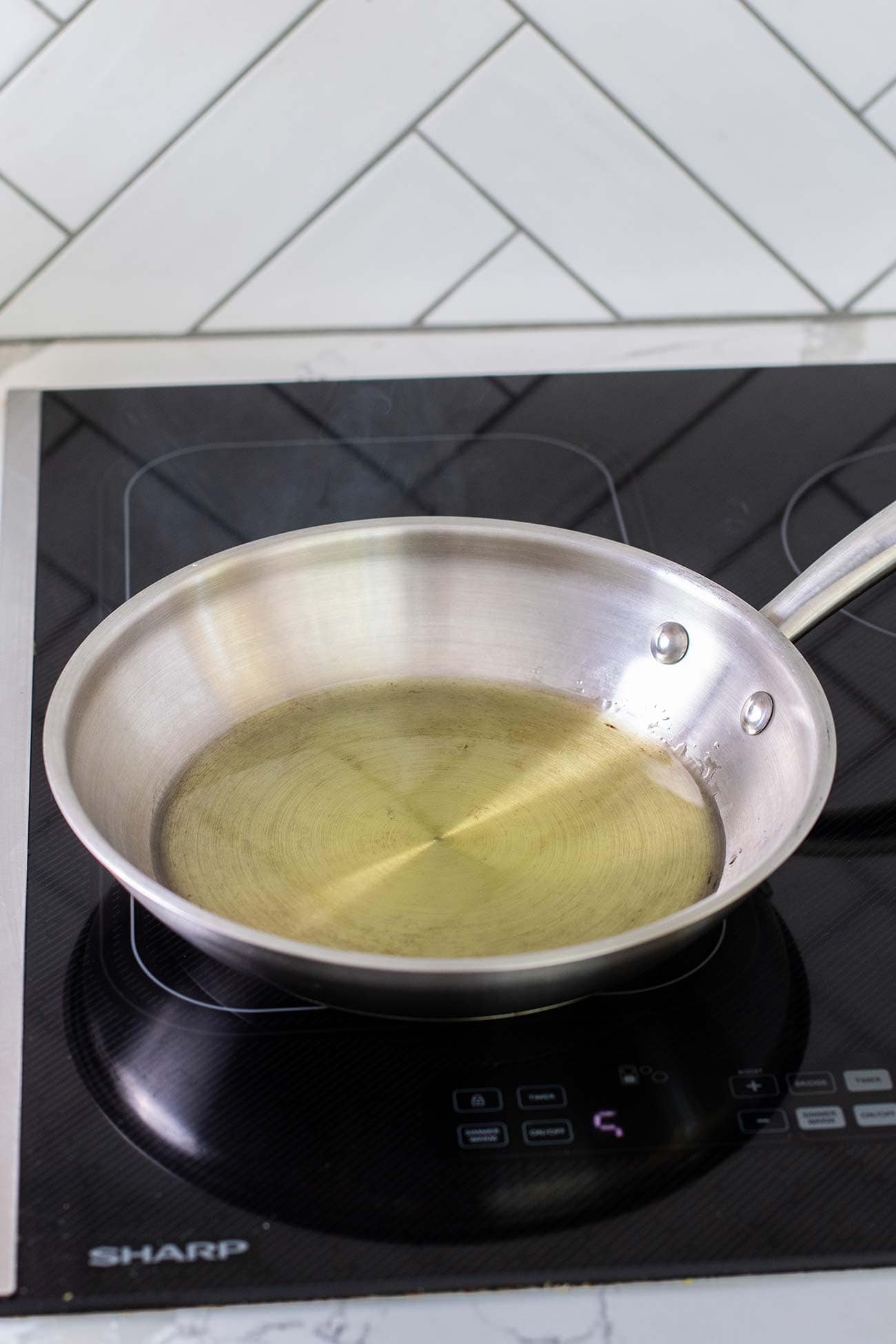 Heat olive oil in a small skillet.