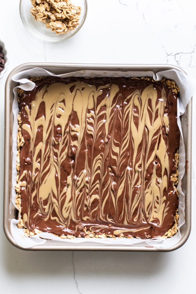 The oatmeal layer topped with chocolate and a sunbutter swirl.