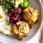 Sausage stuffing balls shown on a holiday plate.