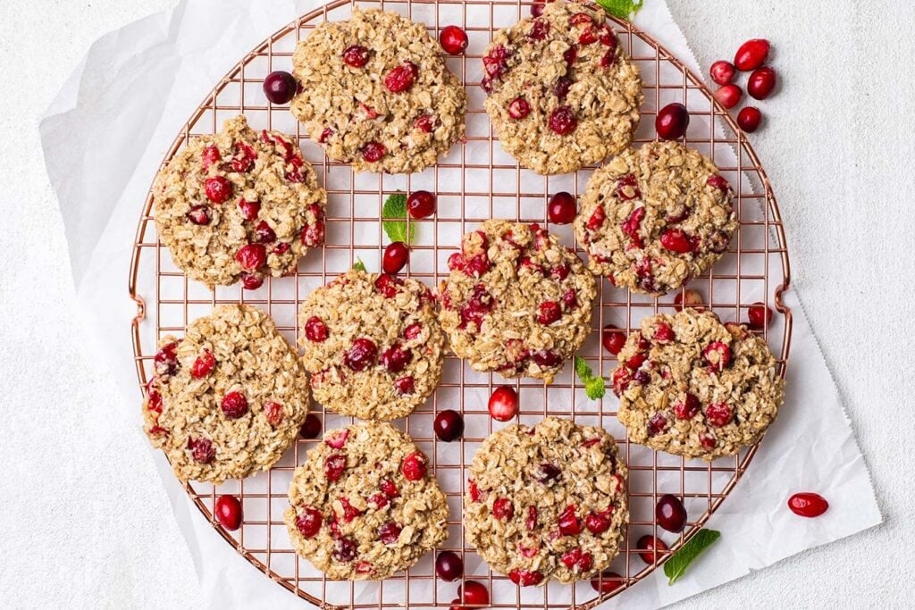 Cranberries and cookies on a cooling rack.