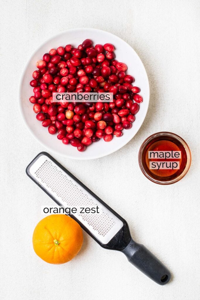 The ingredients needed to make homemade cranberry sauce with maple syrup.