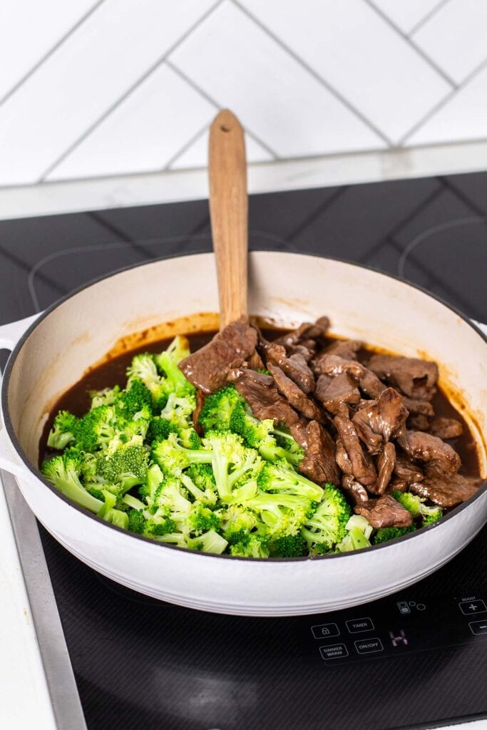 The beef and broccoli added into the pan with the stir fry sauce.