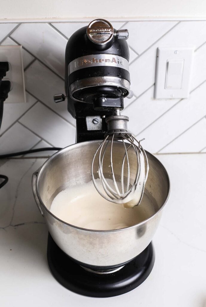 Egg whites and maple syrup combined in a mixer until foamy.