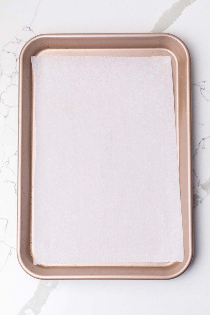 A baking sheet lined with parchment paper.