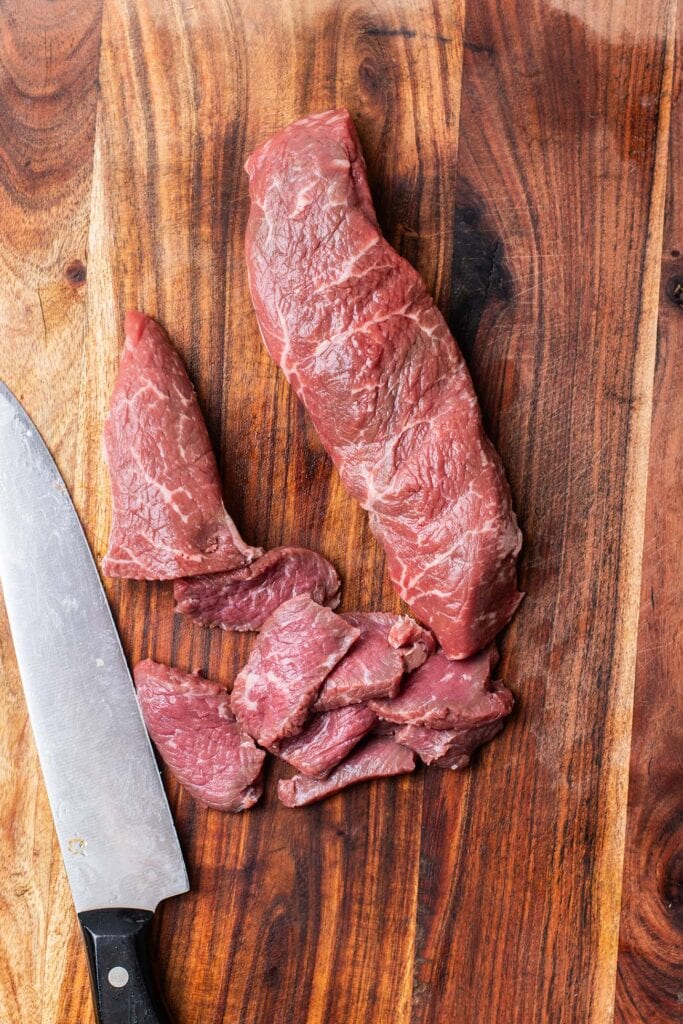 Thinly slice the beef.
