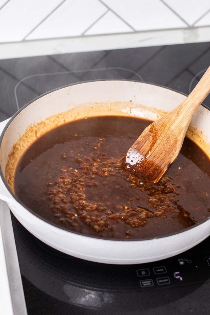 Str fry sauce being heated and thickened.